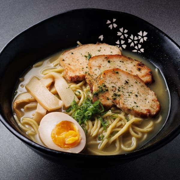 Aja Asian Cuisine & Lounge's ramen bowl with chicken, egg, bamboo shoots, and scallions.