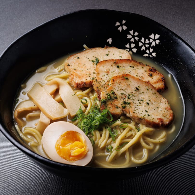 Aja Asian Cuisine & Lounge's ramen bowl with chicken, egg, bamboo shoots, and scallions.